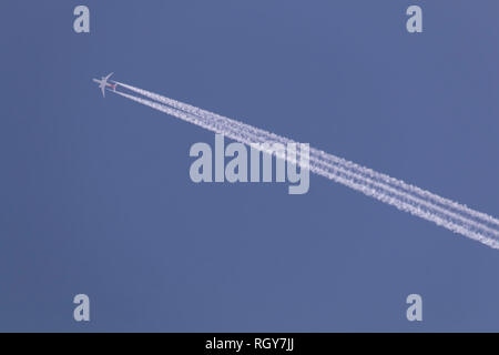 The plane leaves chemical traces in the sky Stock Photo