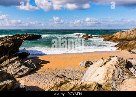 Waves and surf in a cove at Fistral Beach, Newquay, Cornwall, UK Stock Photo