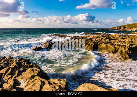 Breaking waves and surf in a cove at Fistral Beach, Newquay, Cornwall, UK Stock Photo