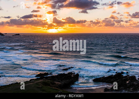 Sunset over waves and surf at Fistral Beach, Newquay, Cornwall, UK Stock Photo