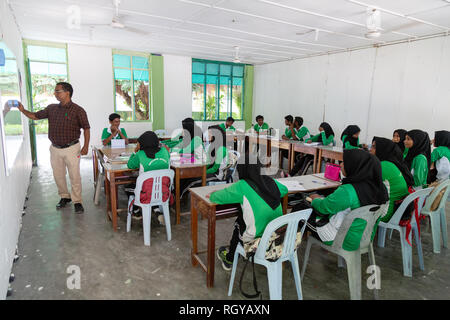 Asia school - a teacher teaching a class of secondary schoolchildren, Ukulhas Island, Alif Alif atoll, the Maldives, Asia Stock Photo