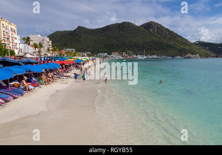 Holiday makers on a beach on the island of St.Maarten in the Caribbean Stock Photo