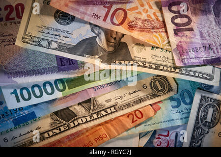 various paper currency bills from different countries Stock Photo