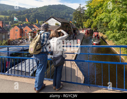 Llangollen, Denbighshire, Wales, United Kingdom.  Boats on the Llangollen canal.  These craft, known as narrowboats, were designed specifically for th Stock Photo