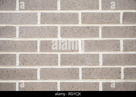 A new grey brick wall for a texture and patterned background. Stock Photo