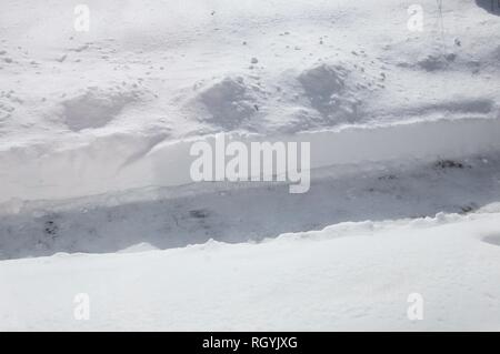 Snow Covered Yard with Shoveled Path for Delivery People after a Snowstorm Stock Photo