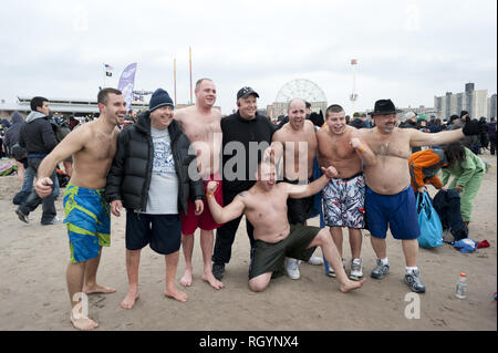 Annual Polar Bear Club New Year's Day plunge into Atlantic Ocean at Coney Island in Brooklyn, NY, Jan.1, 2013. An estimated 2,000 revelers and swimmer Stock Photo