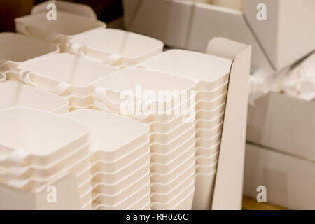 folded white transparent plastic container.stack of plastic containers, boxes.Say no to plastice text and plastice package. Concept of eco pollution Stock Photo