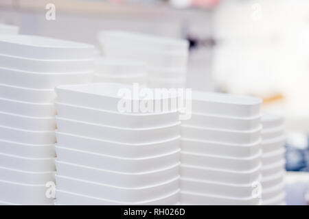folded white transparent plastic container.stack of plastic containers, boxes.Say no to plastice text and plastice package. Concept of eco pollution Stock Photo