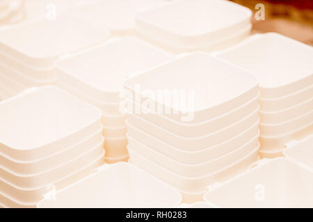 folded white transparent plastic container.stack of plastic containers, boxes.Say no to plastice text and plastice package. Concept of eco pollution Stock Photo