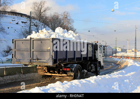 Helsinki, Finland - January 31, 2019: Dump truck takes away snow cleared from streets to a city snow dumping site. Credit: Taina Sohlman/ Alamy Live News Stock Photo