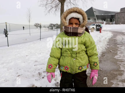 Chicago, USA. 31st Jan, 2019. A child is bundled up for cold winter weather in Chicago, the United States, Jan. 31, 2019. Chicago, the biggest city in the U.S. Midwest, was struck by the polar vortex with the minimum temperature reaching minus 30 degrees Celsius in the city. Credit: Wang Ping/Xinhua/Alamy Live News Stock Photo