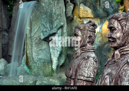 Chinese dragons, statues of ronin and fountains at sunset Russia Stock Photo