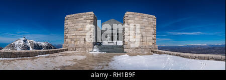 Mt Lovcen, Montenegro - April 2018 : Panoramic view of the two tall statues guarding the entrance to the Njegos Mausoleum on Mount Lovcen Stock Photo