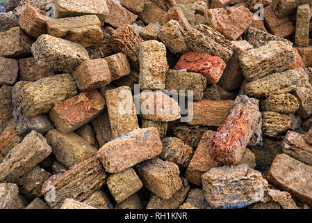 Close up heap of brown shellstone blocks used for building Stock Photo