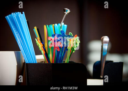 Colourful Plastic Drinking Straws.Bright multicolored straws on the bar. Stock Photo