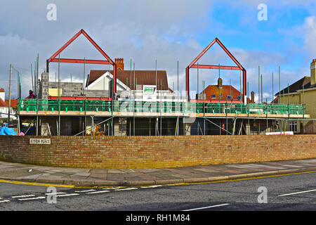 Building site.A steel frame erected as part of an large extension to premises which have stunning sea views over Bristol Channel at Porthcawl, S.Wales Stock Photo