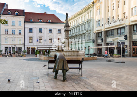 BRATISLAVA, SLOVAKIA - AUGUST 20 2018: Bronze statue of a soldier leaning on main square in Bratislava Stock Photo