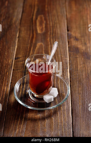 Turkish tea in glass on wooden background Stock Photo