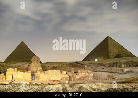Giza pyramids and Sphinx light up at night Stock Photo - Alamy
