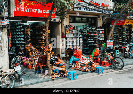 Hanoi, Vietnam, 12.20.18: Life in the street in Hanoi. Vendors try to sell their goods in the busy streets of Hanoi. Stock Photo