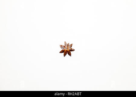Chinese fragrant spice on white background - isolated anise star close up, spice used for making hot mulled wine. Decorative organic decoration. Stock Photo
