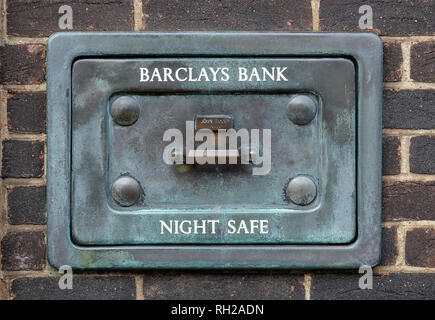old barclays bank night safe in brick wall Stock Photo
