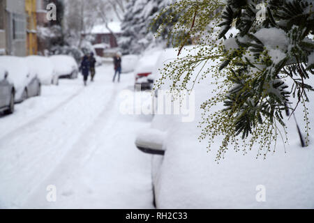 Blurry Snowy Street and Cars Background Stock Photo