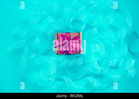 Abstract textured blue background. Ribbon curls top view Stock Photo