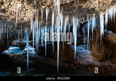 Ice stalactites in the cave Stock Photo