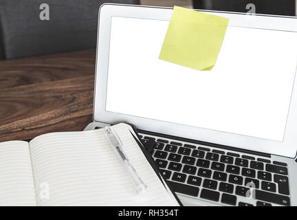 blank yellow adhesive note on laptop screen Stock Photo