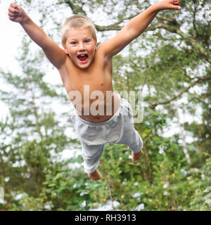 Boy jumping Stock Photo