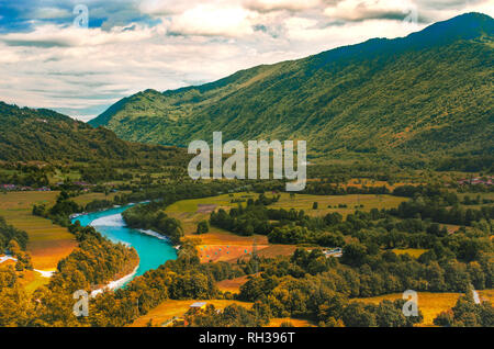 Isonzo Soca river valley  yellow teal and orange sunset landscape in  Slovenia - Italy border Stock Photo