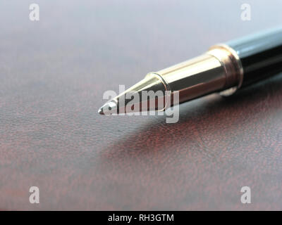 close up.stylish ballpoint pen on notebook sheet Stock Photo