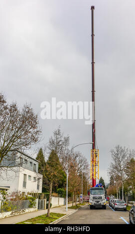 Very large mobile hydraulic crane lifting another crane, Riehen, Basel, Switzerland. Stock Photo
