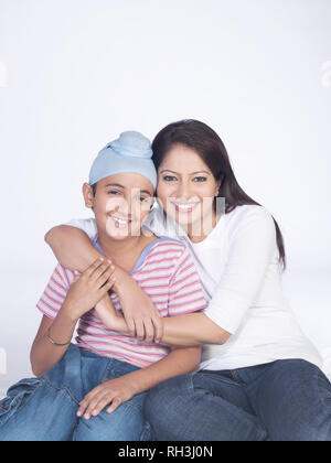 PORTRAIT OF A SARDARNI, SIKH WOMAN WITH HER  SON Stock Photo