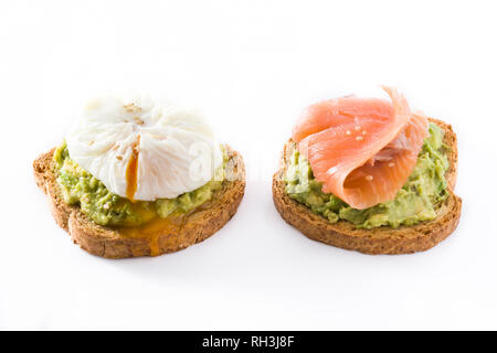 Toasted breads with avocado, poached eggs and salmon isolated on white background. Stock Photo
