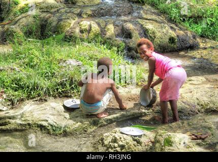 Ni-Van Girl washing dishes Stock Photo