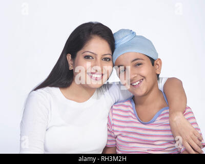 PORTRAIT OF A SARDARNI, SIKH WOMAN WITH HER  SON Stock Photo