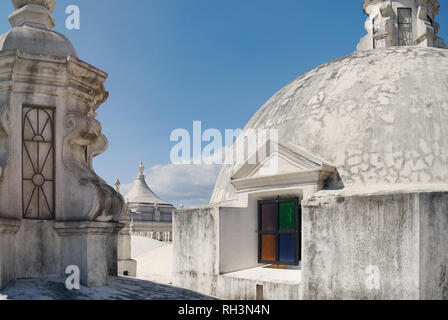 Colorful window on white roof cathedral on sunny day Stock Photo