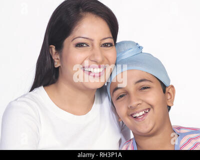 PORTRAIT OF A SARDARNI, SIKH WOMAN WITH HER  SON Stock Photo