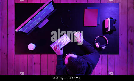 Hacker at the computer hacking. Stock Photo