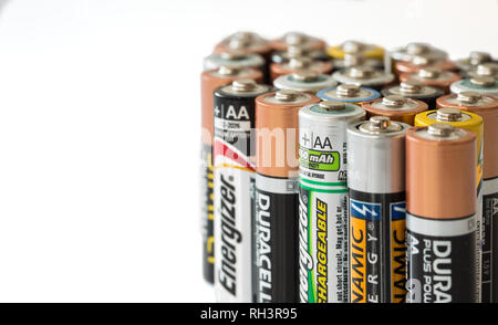 SELBY, UK - JANUARY 30, 2019. A close up of an assortment of disposable and rechargeable batteries of various brands on an isolated white background w Stock Photo