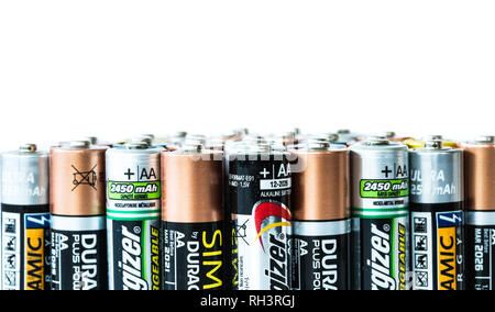 SELBY, UK - JANUARY 30, 2019. A close up of an assortment of disposable and rechargeable batteries of various brands on an isolated white background w Stock Photo