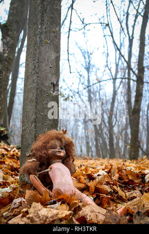 This creepy doll sits outside an abandoned kindergarten inside the Chernobyl exclusion zone. Stock Photo