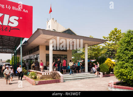 Halong or Ha Long Bay boat ticket office with lots of tourists outside waiting (circa 2009), Vietnam Stock Photo