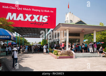 Halong or Ha Long Bay boat ticket office with lots of tourists outside waiting (circa 2009), Vietnam Stock Photo