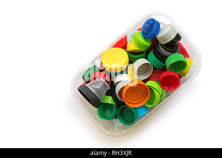 Various colorful plastic screw caps isolated on the white background. Conception of plastic processing for ecology or charity. Stock Photo