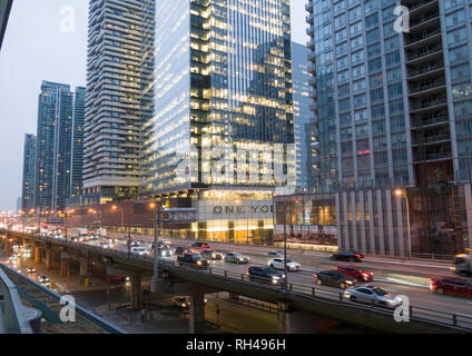 Gardiner Expressway and Condo Towers: A busy raised expressway cuts through high office and condo towers in downtown Toronto  during the morning commute Stock Photo