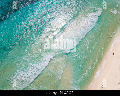 High aerial view of turquoise waters of the Caribbean Sea at Cozumel, Mexico with swimmers. Stock Photo